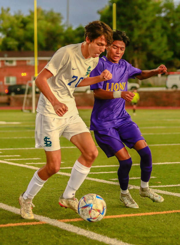 Standley Lake's Nicholas Jaczszyn (70) and a Littleton defender are in a tussle for the loose ball along the sidelines during a Sept. 30 match in Littleton.